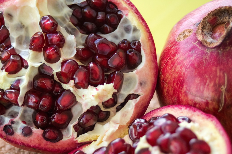 fresh, wellbeing, no people, halved, fruit, indoors, pomegranate, food and drink, seed, slice, garnet, pomegranate seed, close-up, still life, freshness