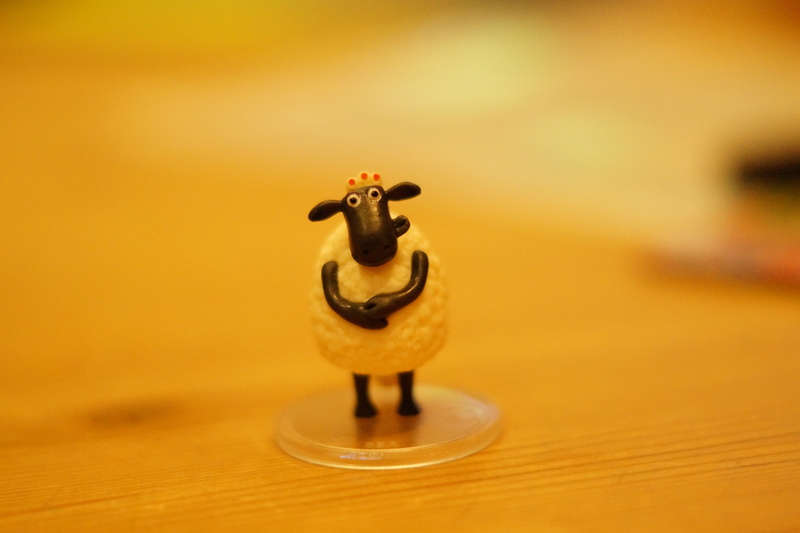 table, 5K, black and white, film, single object, child, dough figure, no people, england, film character, shaun the sheep, antique, collectible, photography