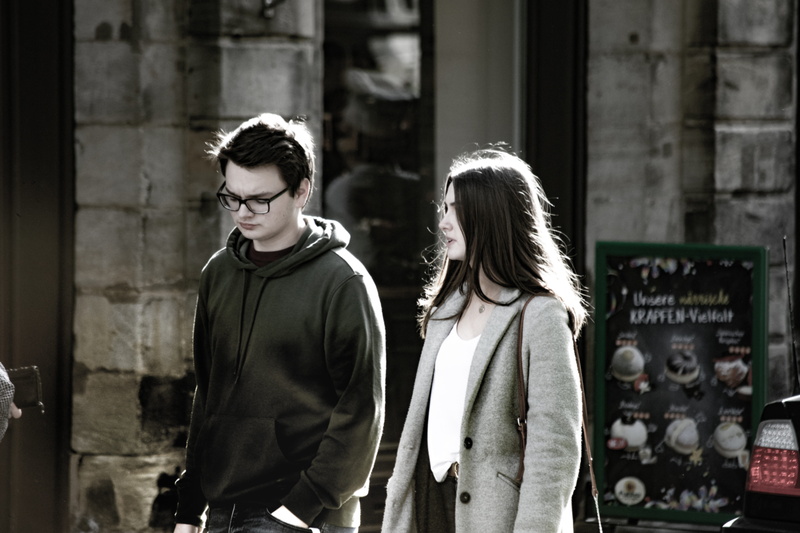 city, lifestyles, disagreement, expression, standing, worried, hairstyle, togetherness, conflict, building exterior, architecture, couple - relationship