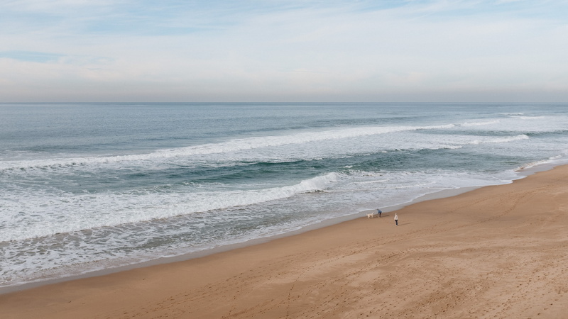 scenery, scenics - nature, ocean, half moon bay, human, tranquility, soil, promontory, non-urban scene, walk, people, landscape, shore, nature, motion