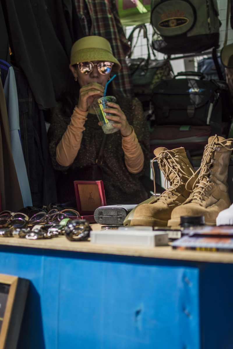 beverage, men, bottle, table, person, drink, business, holding, young adult, alcohol, liquor, clothing, human, south korea, occupation, street photography