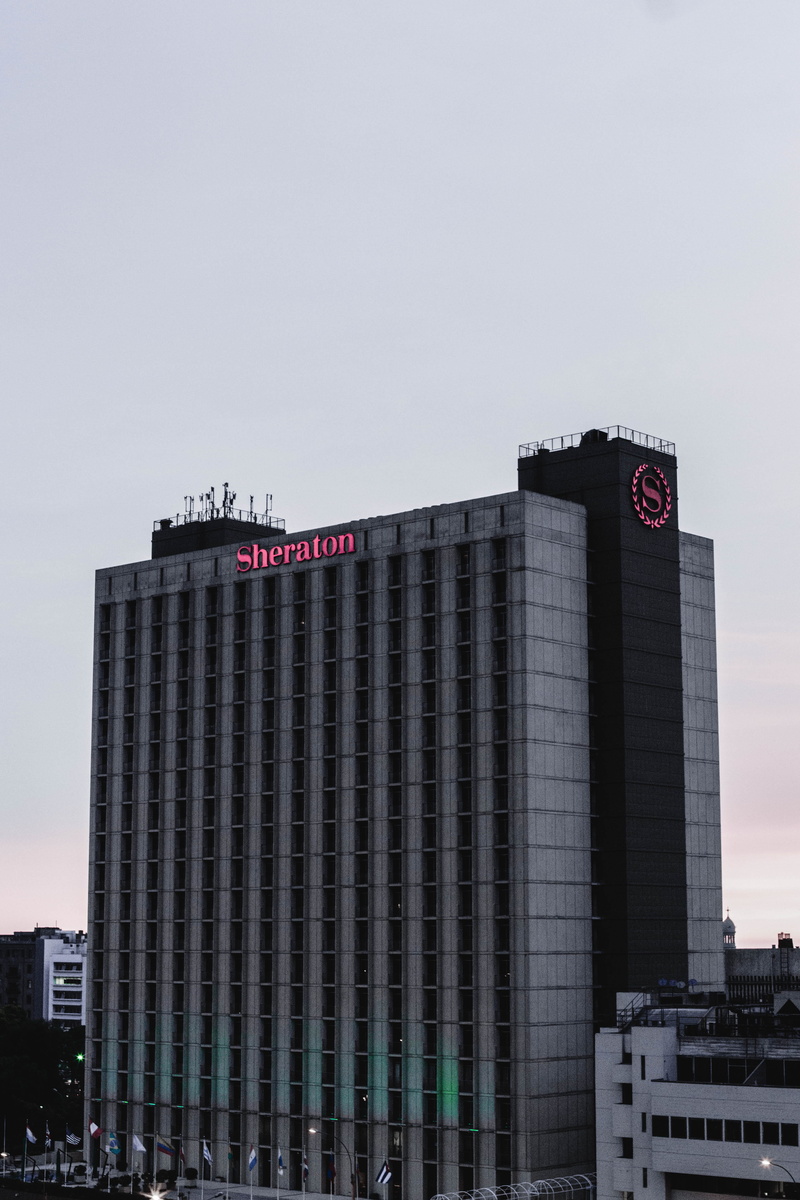 communication, travel destinations, office building, outdoors, copy space, building exterior, office, urban, western script, hotel, city, built structure