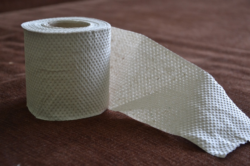 the tape, toilet paper, single object, textured, rolled, two objects, paper, thread, table, focus on foreground, textile, simplicity, pattern, selective focus