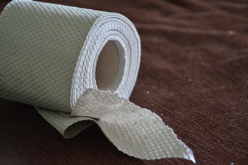 indoors, the tape, paper tape, brown, white color, art and craft, toilet paper, simplicity, close-up, grey paper, single object, white, flooring, textile