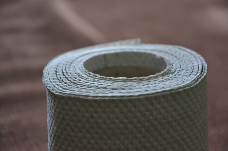 indoors, 2K, rolled up, thread, silver colored, grey paper, the tape, alloy, selective focus, single object, steel, toilet paper, metal, paper tape, still life