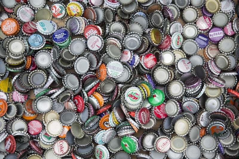 recycling, directly above, retail, indoors, high angle view, soda, variation, still life, jewelry, bottle caps, multi colored, bottle cap, backgrounds