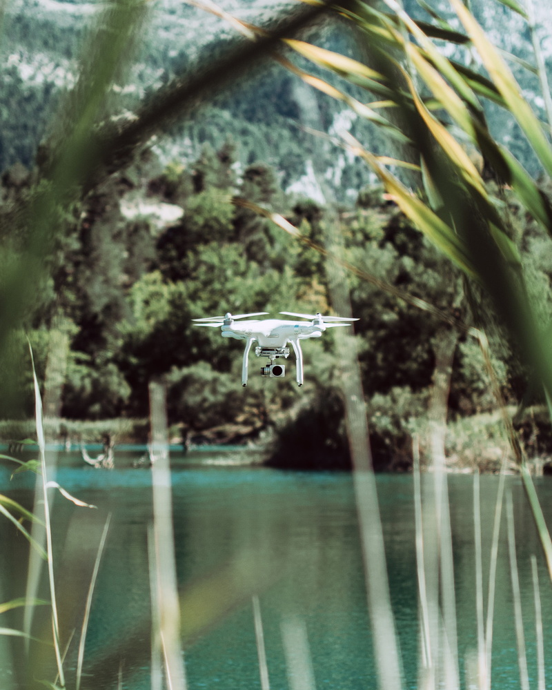 technology, surveillance, vegetation, camera, land, day, air vehicle, outdoors, transportation, lake, photography themes, plant, aerial, flight, aircraft