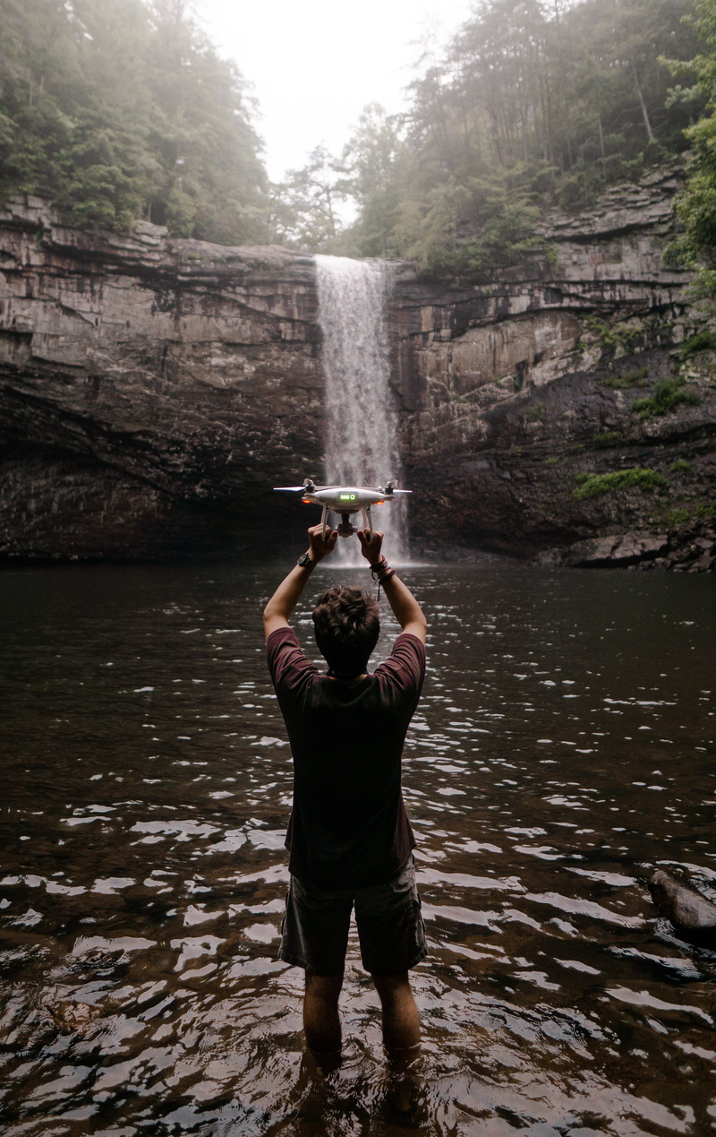 flying, waterfall, videography, dji, day, real people, waterfalls, standing, phantom 4 pro, white, arms raised, drone photo, flight, 5K, back, explore