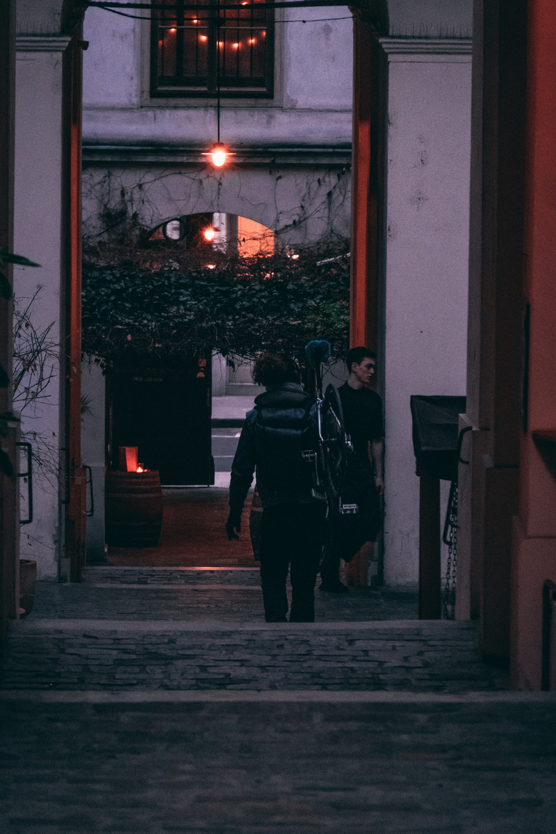 street, afternoon, building exterior, lifestyles, bicycle, evening, illuminated, sunset, mood, built structure, walking, staircase, austria, streets, lighting equipment