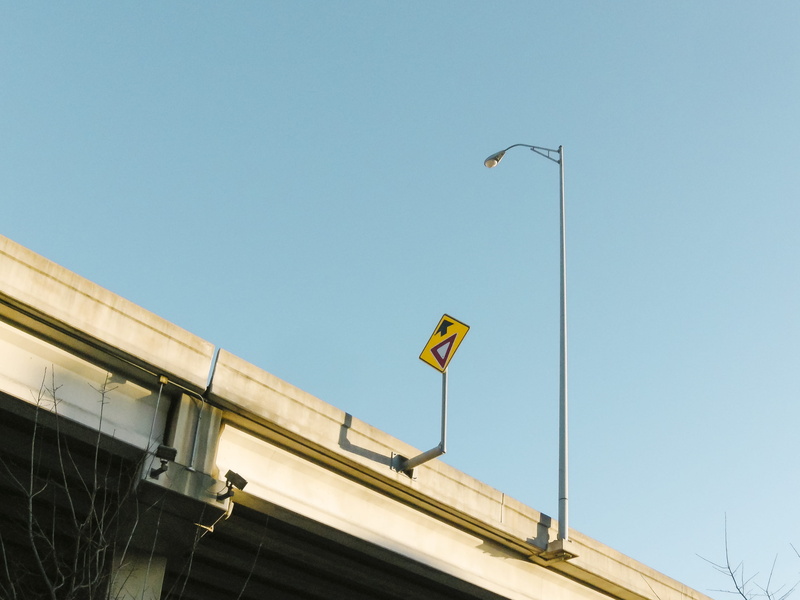 no people, minimalism, sky, low angle view, day, copy space, yellow, lamp post, yield, lighting equipment, high section, clear sky, yield sign, dallas