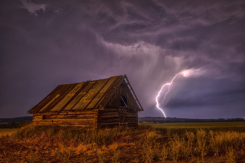 sky, no people, architecture, power in nature, landscape, prairie, beige, wood, power, lightning, grass, barn, thunderstorm, built structure, thunderclouds