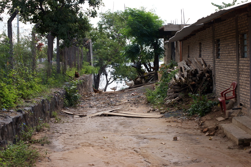 road, dirt, house, building, armchair, paraguay, footpath, brown, land, the way forward, day, street, building exterior, no people, leaf, south america