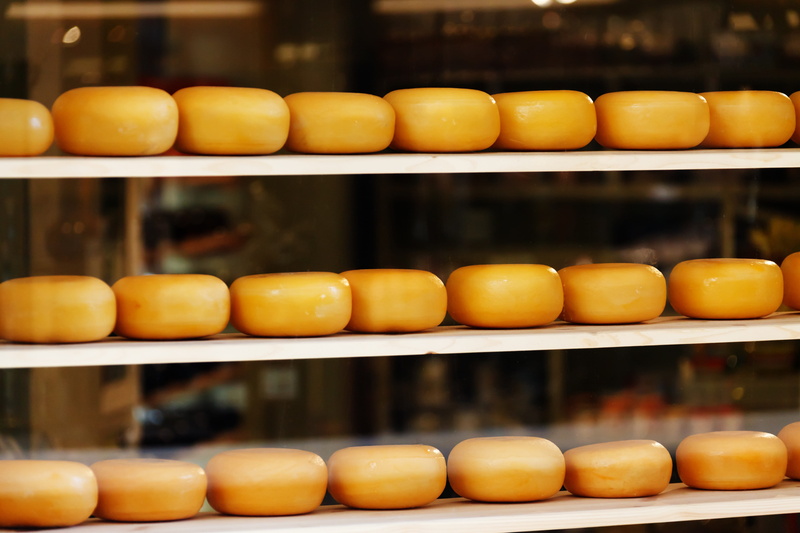 consumerism, oval, dutch, shopping, arrangement, holland, yellow, stack, layers, food and drink, pile, wheel, breads, Dairy, focus on foreground, store