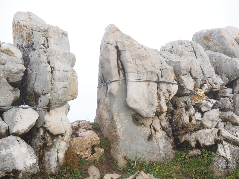 dry stone wall, beauty in nature, nature, tranquility, geology, tranquil scene, no people, passage, day, outdoors, solid, stone wall, rock formation, non-urban scene