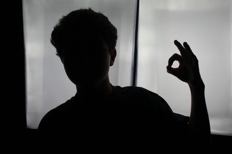 holding, human hand, dark, portrait, day, man, 5K, focus on foreground, boy, human body part, headshot, real people, silhouette, sillhouette, one Person