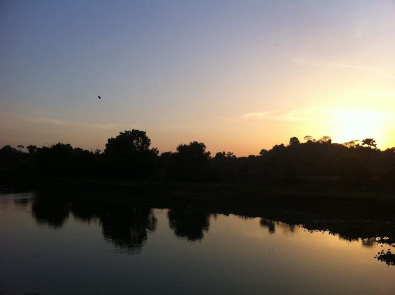 scenic, non-urban scene, 2K, Sunset, view, tranquil, River Bank, tranquility, water, orange color, silhouette, waterfront, tree, outdoors, clouds, reflection