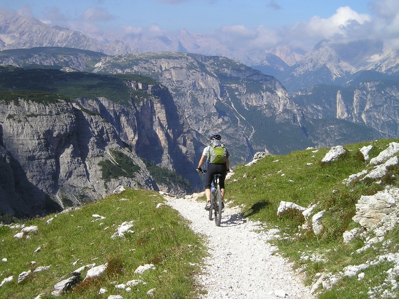 italy, beauty in nature, south tyrol, outdoors, dolomites, bike, mountain range, people, away, sporty, alpine, walking, men, full length, bicycle, formation