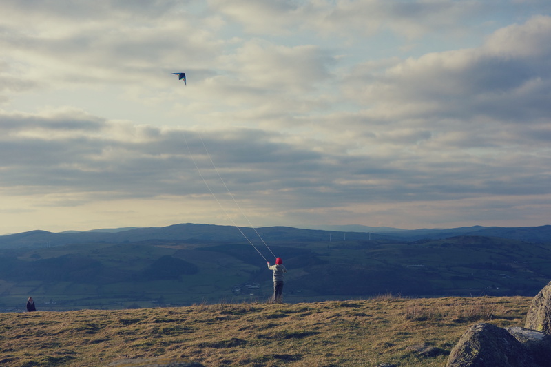 cloudy, child, leisure activity, kid, one person, real people, tranquil scene, cloud - sky, environment, playing, highland, landscape, scenics, view, men