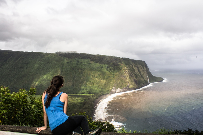 beauty in nature, waipio valley, young adult, sitting, mountain, united states, water, one person, real people, tranquility, flowing water, looking at view