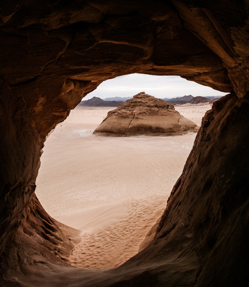 rock, eroded, land, brown, desert, geology, rock - object, nature, tranquil scene, climate, hot, sky, beauty in nature, remote, arid climate, natural arch