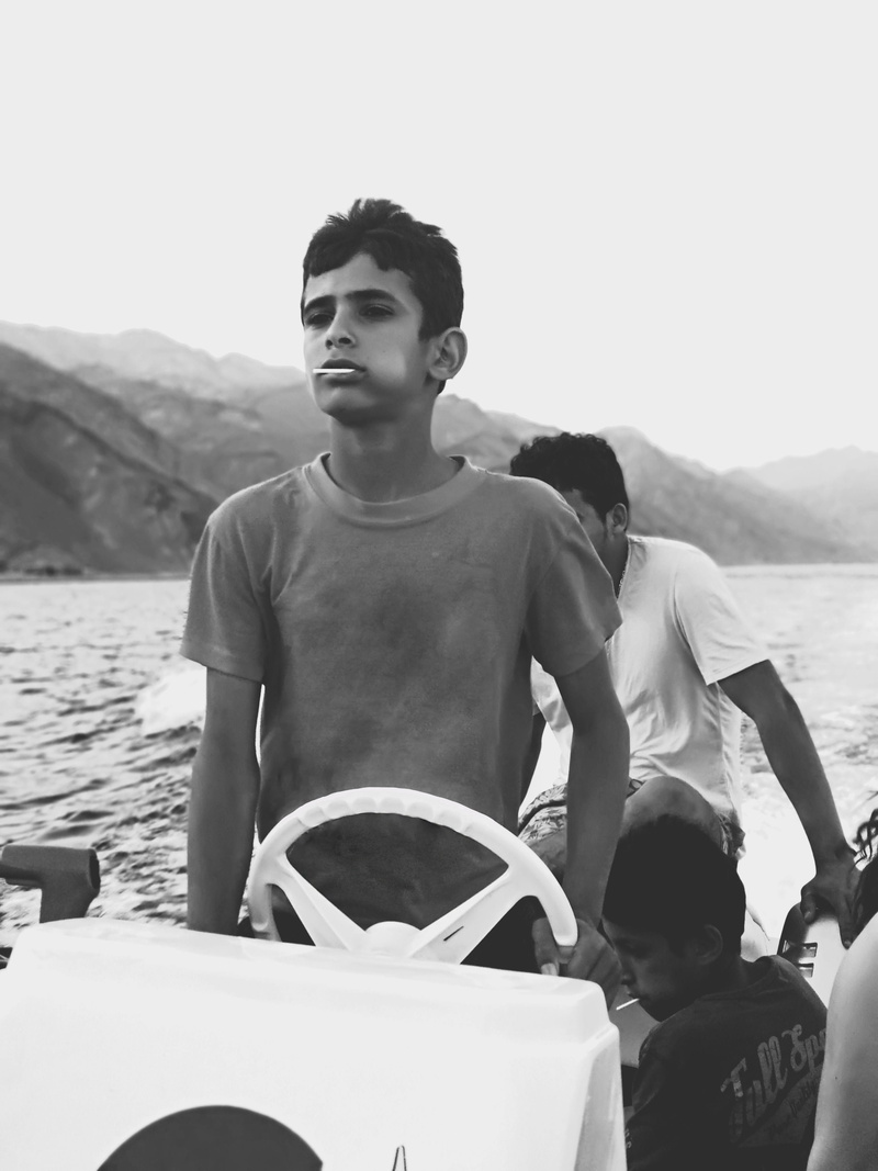 outdoors, men, day, black and white, sea, lifestyles, transportation, water, sky, casual clothing, young men, leisure activity, boys, sinai, child, egypt