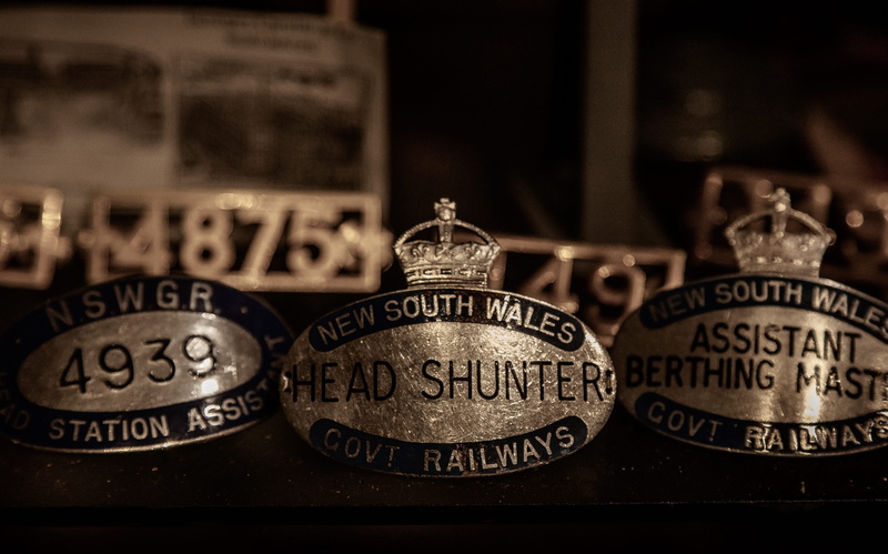showcase, occupation, metal, communication, drink, group of objects, head shunter, business, brass, no people, still life, badge, close-up, indoors, engraved
