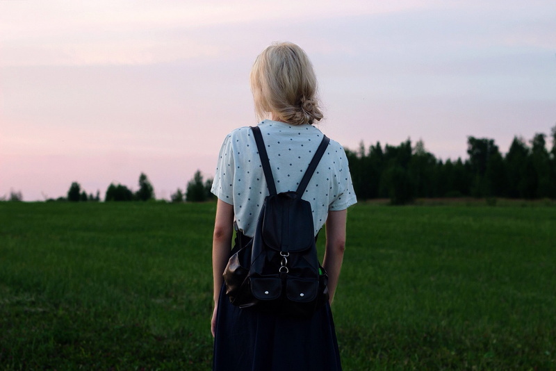 field, looking at view, sunset, lifestyles, plant, real people, leisure activity, environment, land, outdoors, blonde, women outdoors, backpacks, women