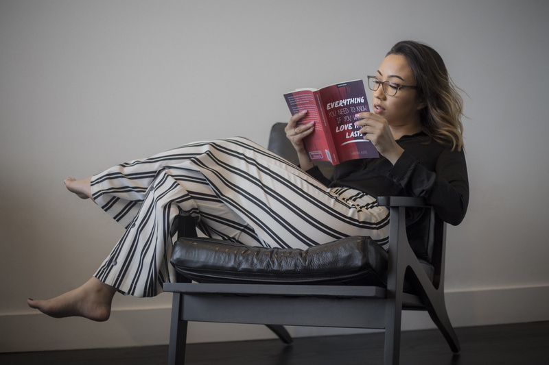 literature, striped, furniture, wooden, wear, armchair, young women, white, woman, girl, seat, chair, knowledge, hairstyle, pants, book, 5K, framed, comfortable