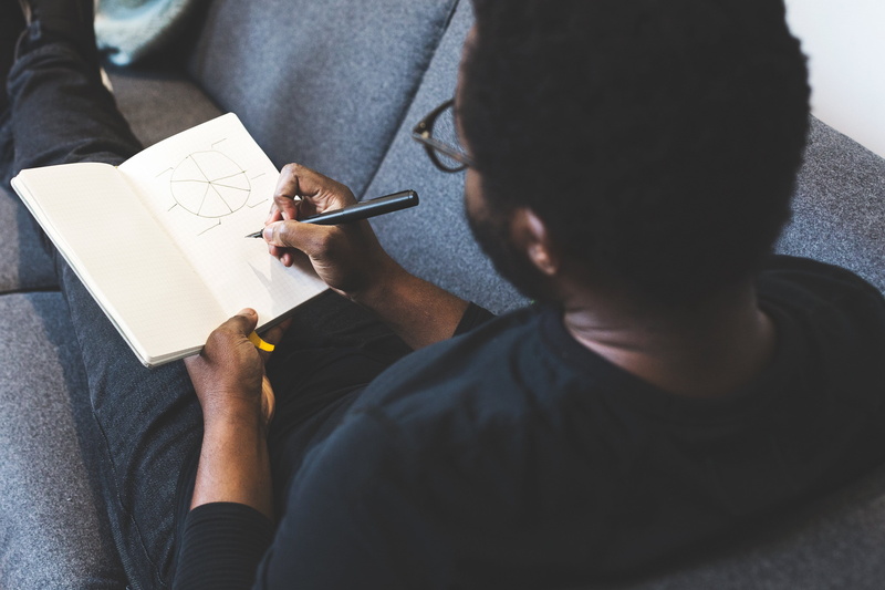 pencil, casual clothing, paper, indoors, high angle view, wear, learn, sketching, close-up, two people, men, midsection, room, notebook, day, adult, man