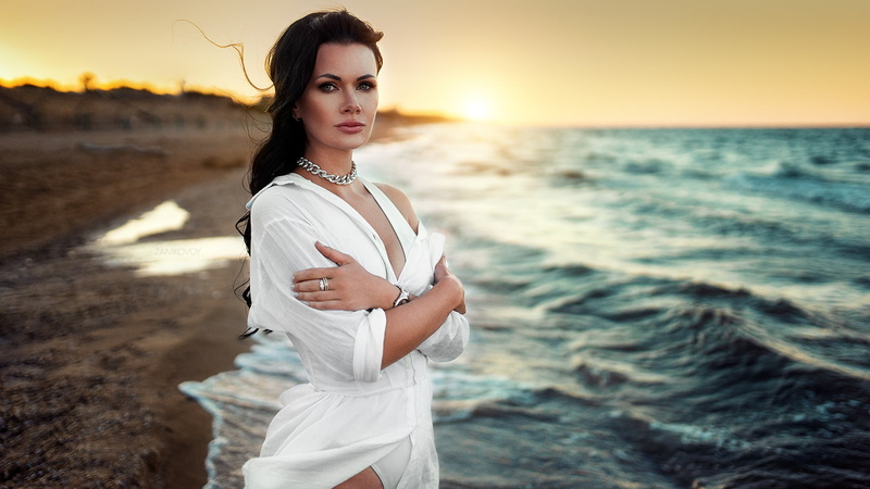 women, dress, mouth, sea, sunset, brunette, dark eyes, 1080P, necklace, looking at viewer, model, Artem Zamkovoy, arms crossed, portrait