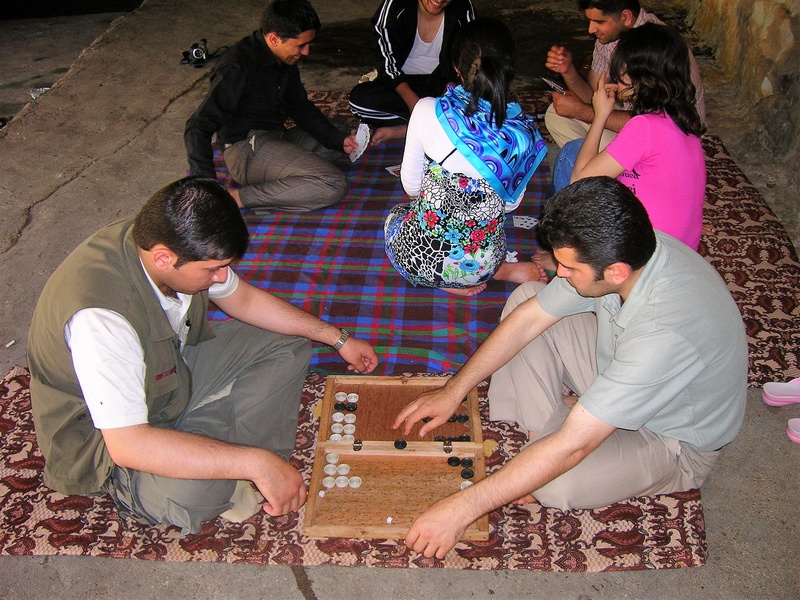 cube, backgammon, casual clothing, game board, strategy, wood, human, young men, play, young women, board game, men, sitting, high angle view, adult, togetherness