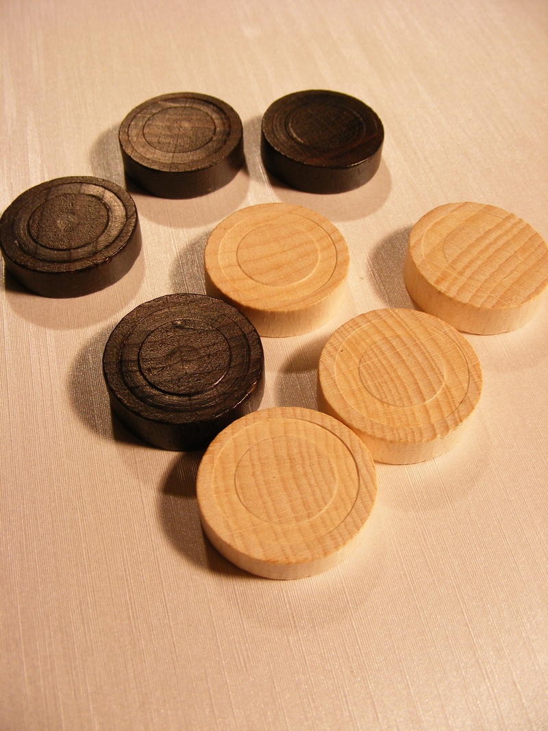 indoors, coin, brown, sports recreation, games, backgammon, geometric shape, shape, white, still life, no people, wood - material, black, circle, table