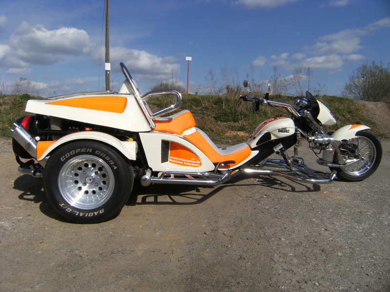 land vehicle, mode of transportation, wheel, motor vehicle, travel, trike, side view, fighter, no people, nature, sky, orange color, day, parking, road