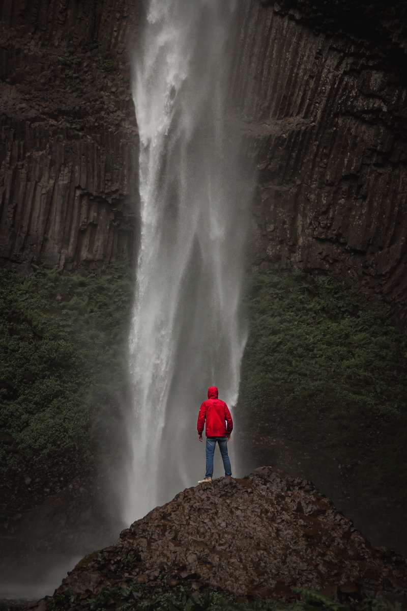 model, scenics - nature, red, blue, daytime, cliff, person, adventure, waterfall, looking at view, 5K, power in nature, wanderlust, lifestyles, pnw, blurred motion