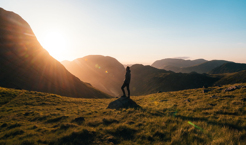 silhouette, arms raised, sunbeam, dawn, hiking, mountains, landscape, human arm, golden, front, lens flare, dusk, photography, fog, back lit, sunrays, mountain range