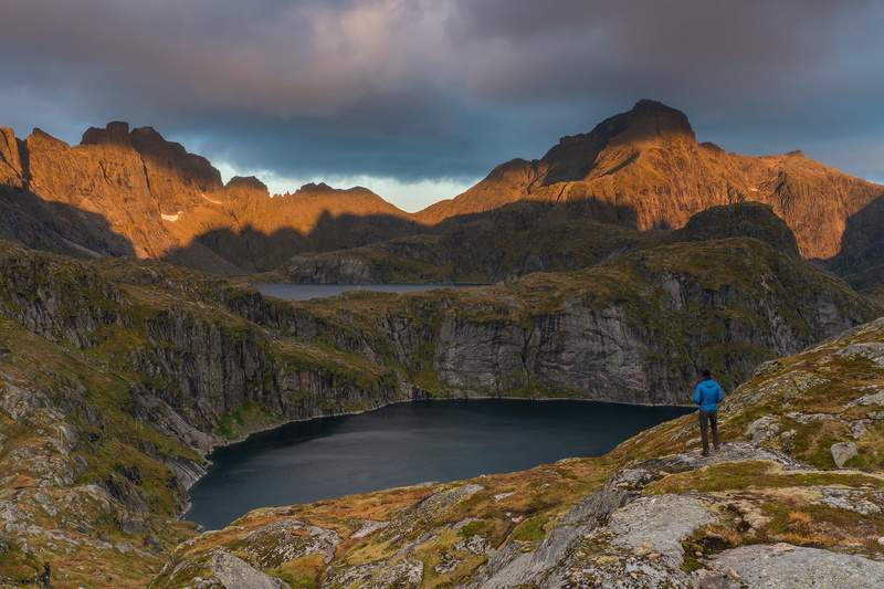 outdoors, travel, landscape, hiking, daytime, black, Norway, blue, man in blue, Morning Light, sunrise, mountain, pants, Lofoten, front, adventure, blue jacket
