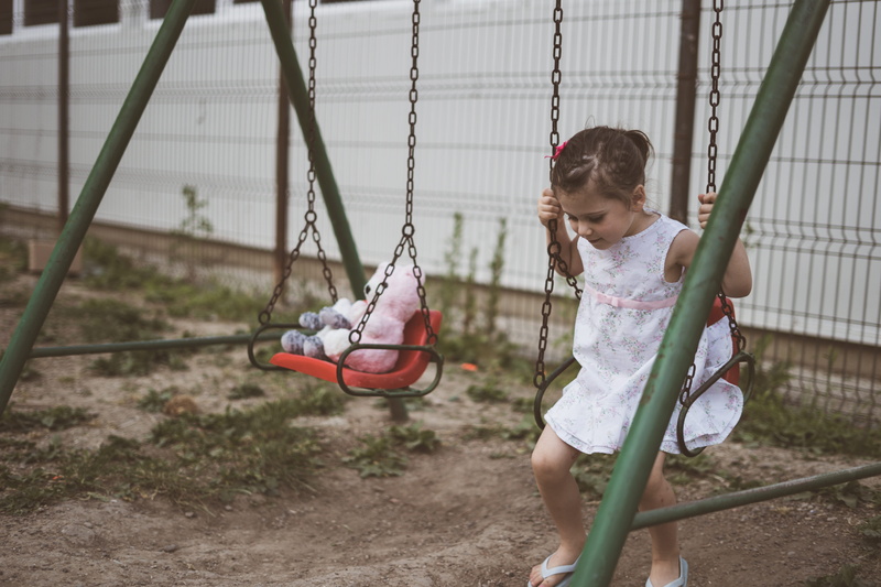 outdoor play equipment, playground, holding, julia, 5K, playtime, day, real people, lifestyles, bear, one person, hairstyle, full length, s, steel, red