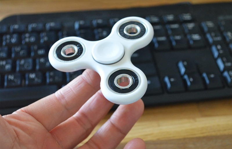 finger, bearing, body part, indoors, holding, communication, entertainment, unrecognizable person, connection, computer equipment, relaxing, focus on foreground