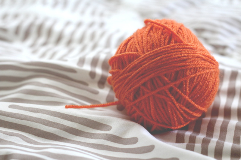 softness, white color, creativity, textile, single Object, knitting needle, cotton, tangle, orange color, backgrounds, string, yarn, no People, craft Product