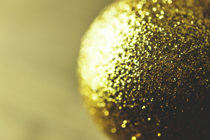 selective focus, wealth, luxury, studio shot, Closeup, DSLR, indoors, captured, gold Colored, backgrounds, christmas decoration, copy space, freshness