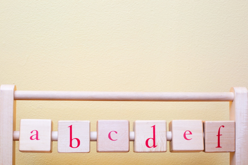 multi colored, copy space, organization, yellow, alphabet, letter, Toys, 4K, wood - material, nursery, in a row, message, side by side, beige background