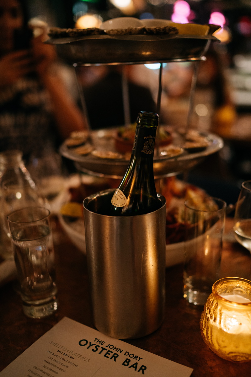bottle, united states, interior, container, table, bottle of wine, indoors, glass, bar counter, no people, business, text, focus on foreground, food, new york