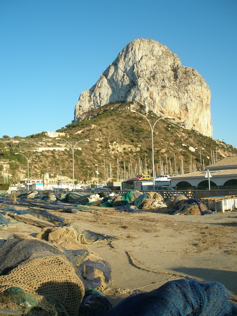 clear sky, mountain, land vehicle, blue, rock, nature, motor vehicle, spain, 2K, solid, calpe, outdoors, sunlight, beach, land, water, rock - object, transportation