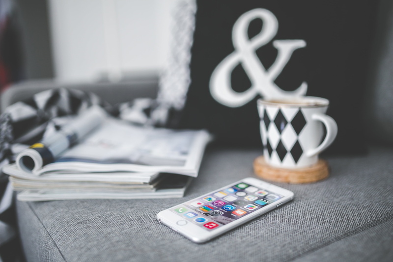 cup, day, screen, iphone 6, table, magazine, no people, apple, iphone 6 plus, stack, business, device, dollar sign, tech, home decor, group of objects