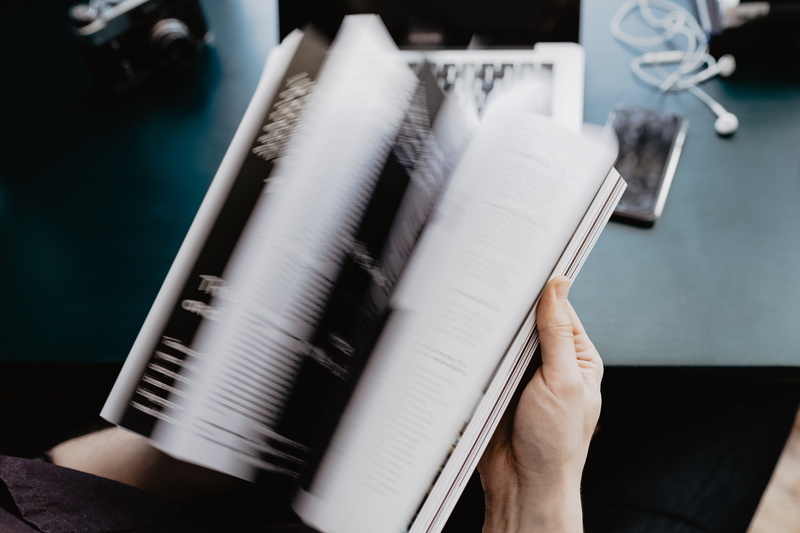 high angle view, education, selective focus, desk, magazine, time, indoors, studying, book, human body part, note pad, human hand, 4K, learning, reading