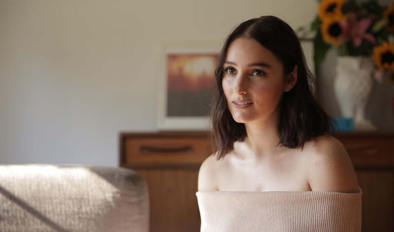 contemplation, domestic room, looking at camera, one person, home interior, brown hair, indoors, domestic life, focus on foreground, portrait, adult, headshot