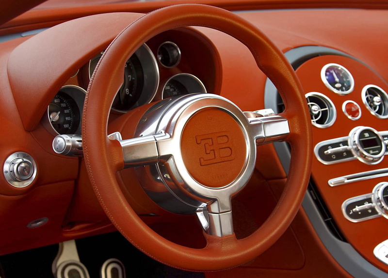 uml, close-up, vehicle part, land vehicle, motor vehicle, luxury, brown, s, dashboard, red, mode of transportation, fbg, transportation, wheel, control panel
