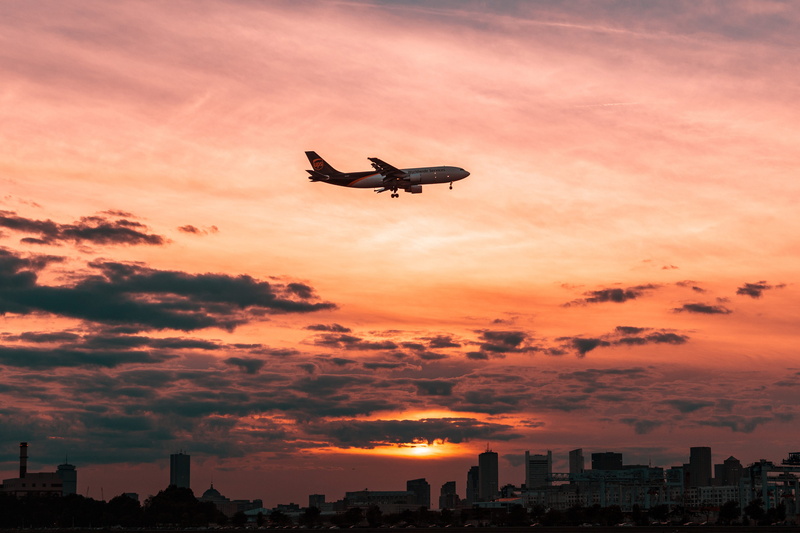 building exterior, sky, skyscraper, 4K, mid-air, silhouette, orange color, cityscape, nature, aeroplane, no people, flying, city, outdoors, cloud - sky
