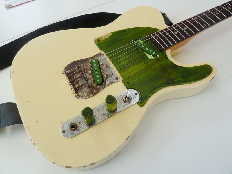 electric, temptation, musical instrument, lawsuit era, close-up, s-2352 model, indoors, guitar, green color, electric guitar, string, table, no people