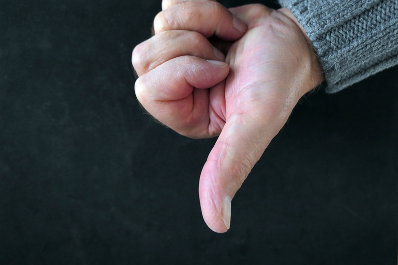 black background, indoors, limb, human finger, thumb, body part, real people, studio shot, close-up, negative, human limb, men, bad, emotion, finger, human hand
